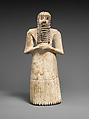 Standing male worshiper, Gypsum alabaster, shell, black limestone, bitumen, Sumerian