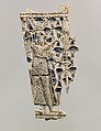 Openwork furniture plaque with a falcon-headed figure in a papyrus thicket, Ivory, Assyrian