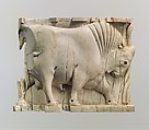 Furniture or cosmetic box plaque carved in relief with a striding bull, Ivory, Assyrian
