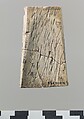 Champlevé furniture or cosmetic box plaque with a winged youth, Ivory, Assyrian