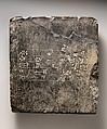 Cuneiform tablet: Sumerian dedicatory(?) inscription from Ekur, the temple of the god Enlil, Black marble, Kassite