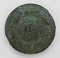 Roundel with head of a "hero" surrounded by caprids, Bitumen, gold and silver foil, Elamite