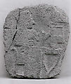 Relief: woman seated at a table, Basalt