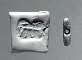 Rectangular plaque seal, indented at string holes, Chlorite or steatite, black