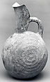 Spouted jug with raised concentric circles, Ceramic