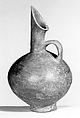 Spouted jug with a mottled surface, Ceramic