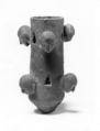 Tubular object with projecting human heads and triangular cut-outs, Bronze, Iran