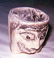 Bowl with human head, Faience