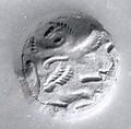 Bell-shaped seal with perforated fist-shaped handle, Ceramic, green, Achaemenid