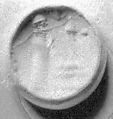 Stamp seal (conoid) with cultic scene
, Banded and flawed blue Chalcedony (Quartz), Assyro-Babylonian