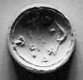 Double convex discoid (bulla) seal engraved on two faces, Yellow steatite, Hittite