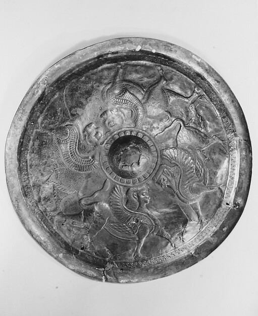 <bdi class="metadata-value">Disc with sphinxes and winged bulls 14 1/4 in. (36.2 cm)</bdi>