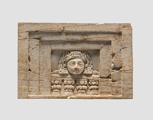 Furniture plaque carved in relief with a “woman at the window”