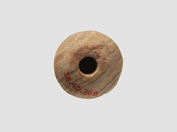 Stone spindle whorl excavated near Nishapur in Iran