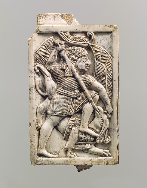 <bdi class="metadata-value">Furniture plaque carved in relief with a male figure slaying a griffin H. 4 1/8 x W. 4 11/16 x D. 7/16 in. (10.5 x 11.9 x 1.1 cm)</bdi>