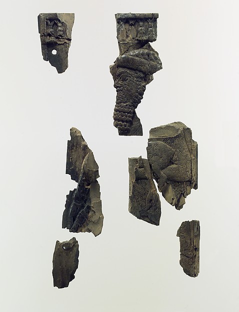 Plaque fragments with a bearded male dignitary carrying a young goat 2.83 x 1.5 x 0.43 in. (7.19 x 3.81 x 1.09 cm)