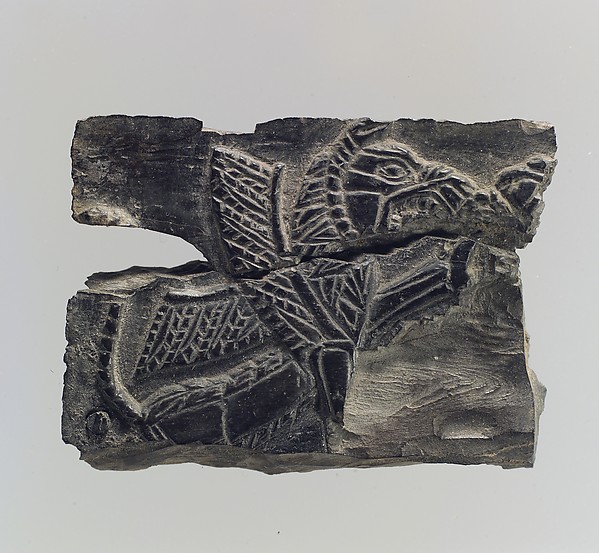 Plaque with a seated, winged leonine monster possibly with scorpion tail 1.34 x 1.89 x 0.25 in. (3.4 x 4.8 x 0.64 cm)
