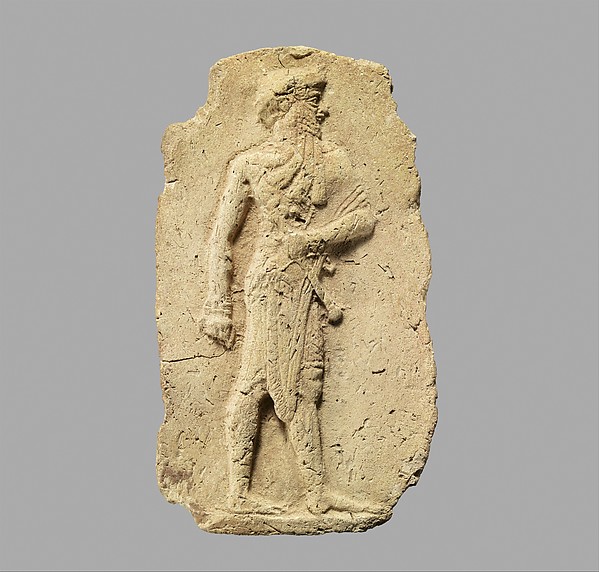 Molded plaque: king or a god carrying a mace H. 12.1 cm, W. 7.1 cm