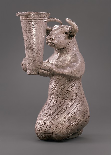 Kneeling bull holding a spouted vessel 6 7/16 x 2 1/2 x 4 1/4in. (16.3 x 6.3 x 10.8cm)
