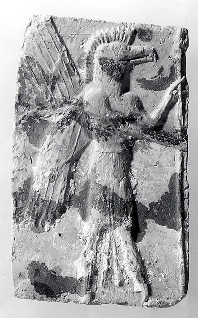 Molded plaque: eagle-headed apkallu 5.25 x 3.25 in. (13.34 x 8.26 cm)
