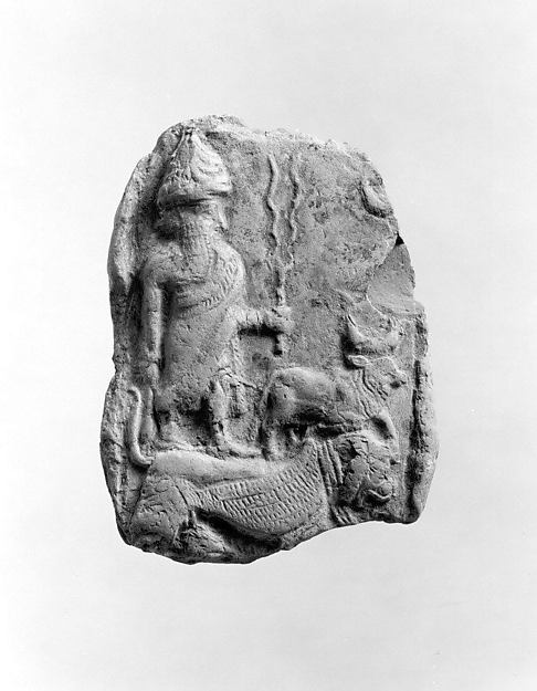 Molded plaque: the weather god Adad and a bull standing on a lion-dragon 5.25 x 3.86 in. (13.34 x 9.8 cm)