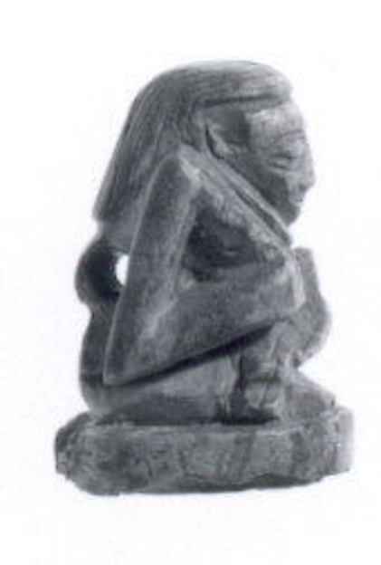 Seated scribe seal 2.26 x 1.52 x 1.6 cm.
