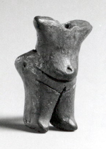 Standing female (with a hole for attachment of the head, now missing) 1.57 x 1 x 0.84 in. (3.99 x 2.54 x 2.13 cm)