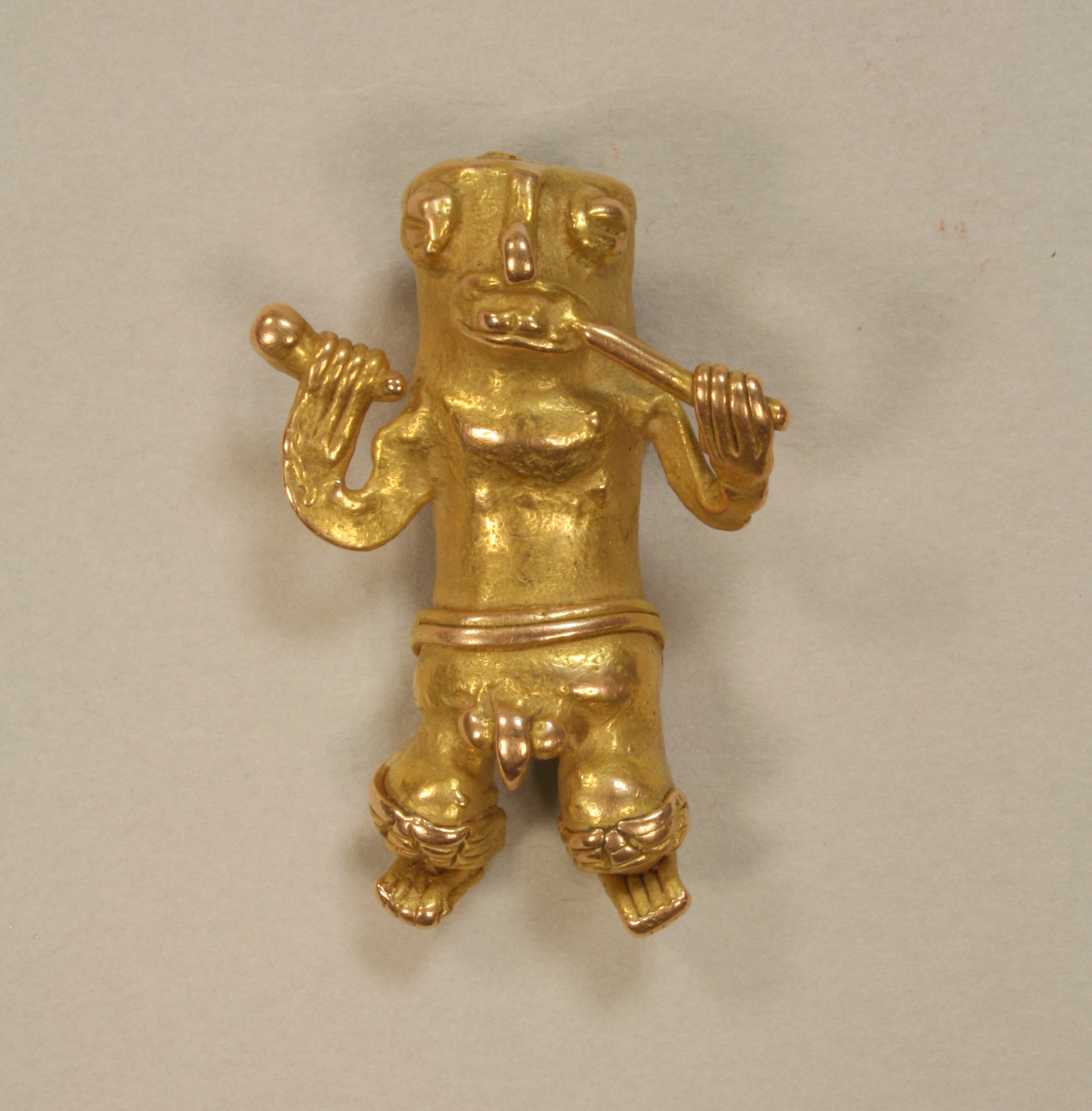 Cast Gold Pendant Of Man With Flute Chiriqui The Metropolitan Museum Of Art