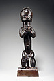 Figure from a Reliquary Ensemble: Seated Male Holding Vessel, Wood, brass or copper, Fang peoples