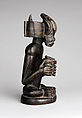 Commemorative figure of a chief playing a sanza (thumb piano), Wood, kaolin, Chokwe peoples