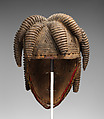 Agbogho mmuo (maiden spirit) face mask, Igbo artist, Wood, pigment, cloth, wire, thread, applied organic material, Igbo peoples