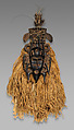 Kpeliye’e headdress, Senufo artist, Wood, horns, raffia fiber, cotton cloth, feather, metal, sacrificial material, Senufo
