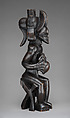 Mwanangana (lord of the land) playing a sanza, Chokwe artist, Wood (uapaca), cloth, plant fiber, beads, dye, resinous coating, Chokwe