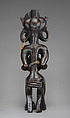 Mwanangana (lord of the land) playing a sanza, Chokwe artist, Wood (uapaca), cloth, plant fiber, beads, dye, resinous coating, Chokwe