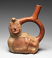 Stirrup spout bottle with peanut figure, Moche artist(s), Ceramic, slip, Moche