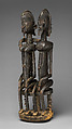 Seated couple, "Barnes Foundation Master" (active late 18th–early 19th century[?], Bandiagara Escarpment, Mali), Wood, copper and iron alloy, applied organic materials, Dogon