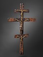 Triple Crucifix, Kongo artist, Open-back cast brass (central figure), solid cast brass (top and bottom figures), forged iron nails, brass, copper, wood, ultramarine pigment, Kongo