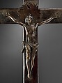 Crucifix, Solid cast brass (Christ), solid cast copper alloy (halo); hollow cast bronze (three end pieces), brass sheet (one end piece), solid cast copper alloy (Mary); forged copper and brass (nails), wood, Kongo peoples; Kongo Kingdom