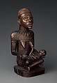 Figure: Seated Female Supporting Figure Clasping Her Breast, Master of Kasadi, Wood, glass, kaolin, Kongo peoples; Yombe group