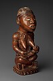 Figure: Seated Female Nursing Child, Master of the Boma-Vonde Region, Wood, kaolin, glass, Kongo peoples; Yombe group