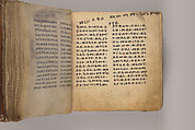 Arganonä Maryam (The Organ of Mary) prayer book, Attributed to Baselyos (The Ground Hornbill Master) (active late 17th century, Lasta region, Ethiopian), Parchment, pigment ink, wood, leather, fiber