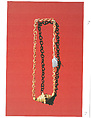 Necklace of plaited rings with horizontal cylinder, Songhay artist, Straw, beeswax, Songhay