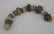 String of flattened beads, Stone, ceramic, Mexican