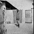 Man Standing in a Courtyard, Oumar Ka Senegalese, Inkjet print, 2015