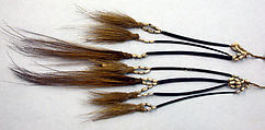 Tassels, Cassowary feathers, cassowary quills, seeds, fiber, Asmat people