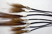 Tassels, Cassowary feathers, cassowary quills, seeds, fiber, Asmat people