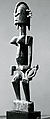 Female with Small Figure, Dogon blacksmith, Wood, metal, leather, Dogon peoples