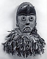 Face Mask, Wood, feathers, cotton, thread, fiber, iron, animal teeth, sacrificial materials, Dan peoples