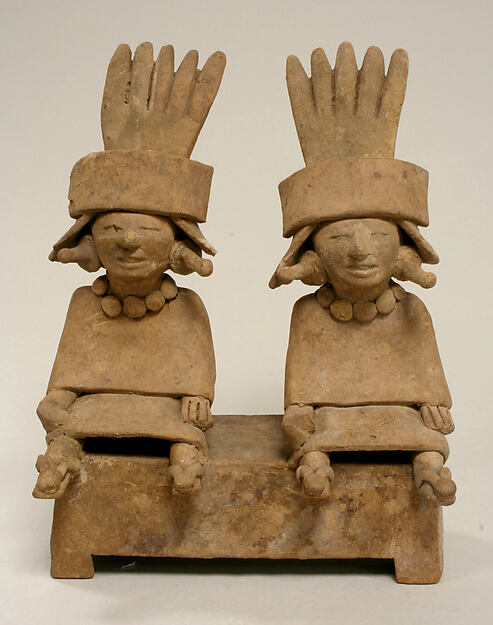 Two Ceramic Figures Seated on a Bench