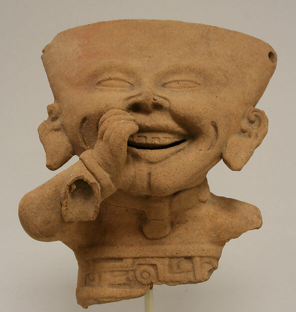 Fragmentary Smiling Figure